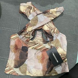 Underbust Halterneck Cross Over Zip Corset
Size: 4